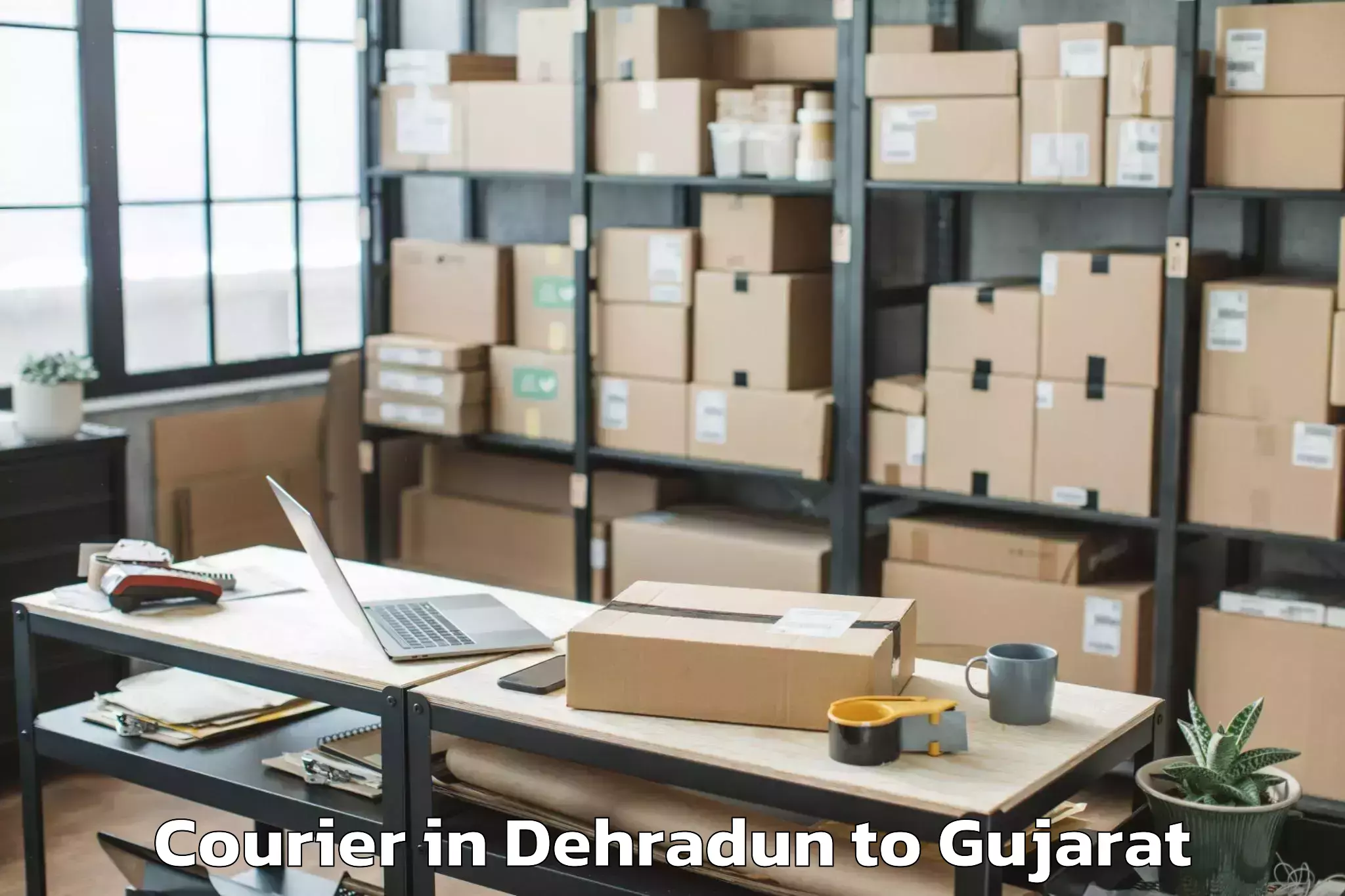 Reliable Dehradun to Sanand Courier